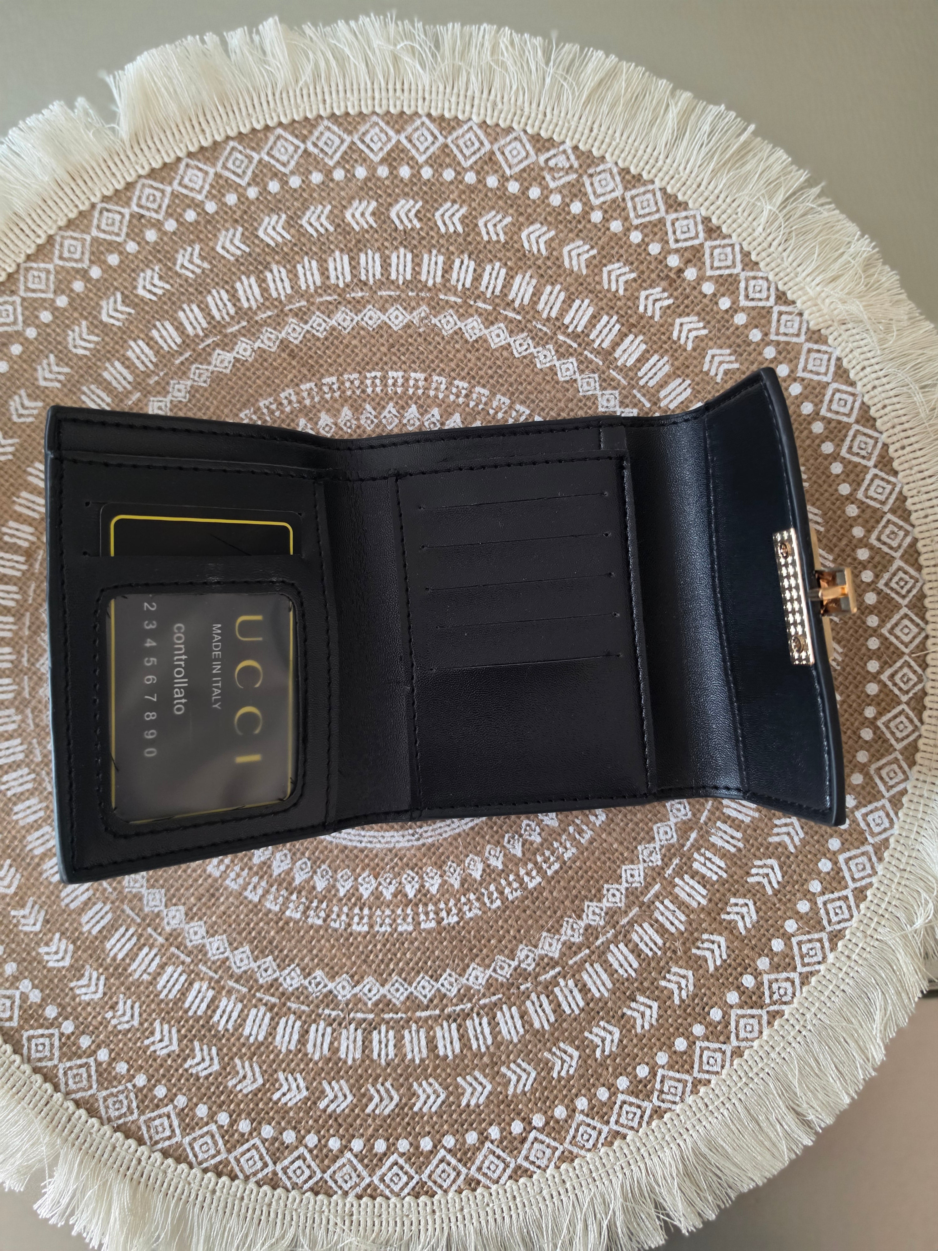 Gucci GG Supreme compact wallet — interior flat lay open