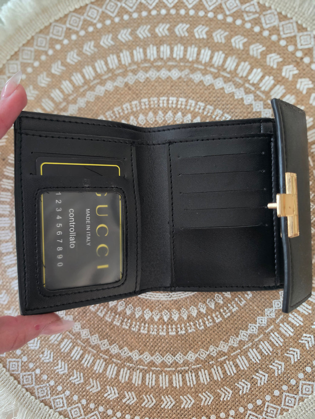 Gucci GG Supreme compact wallet — interior open showing card slots