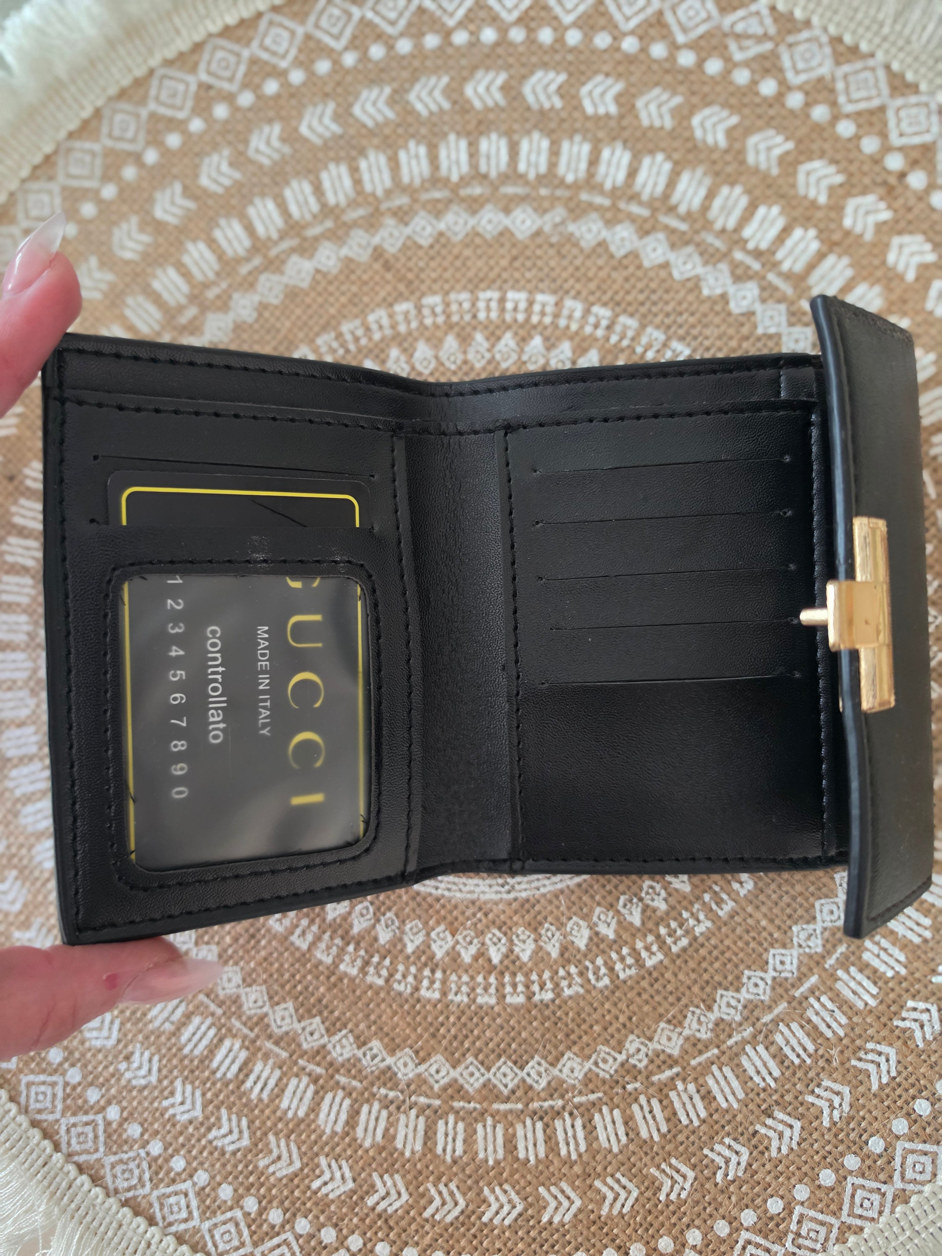 Gucci GG Supreme compact wallet — interior open showing card slots