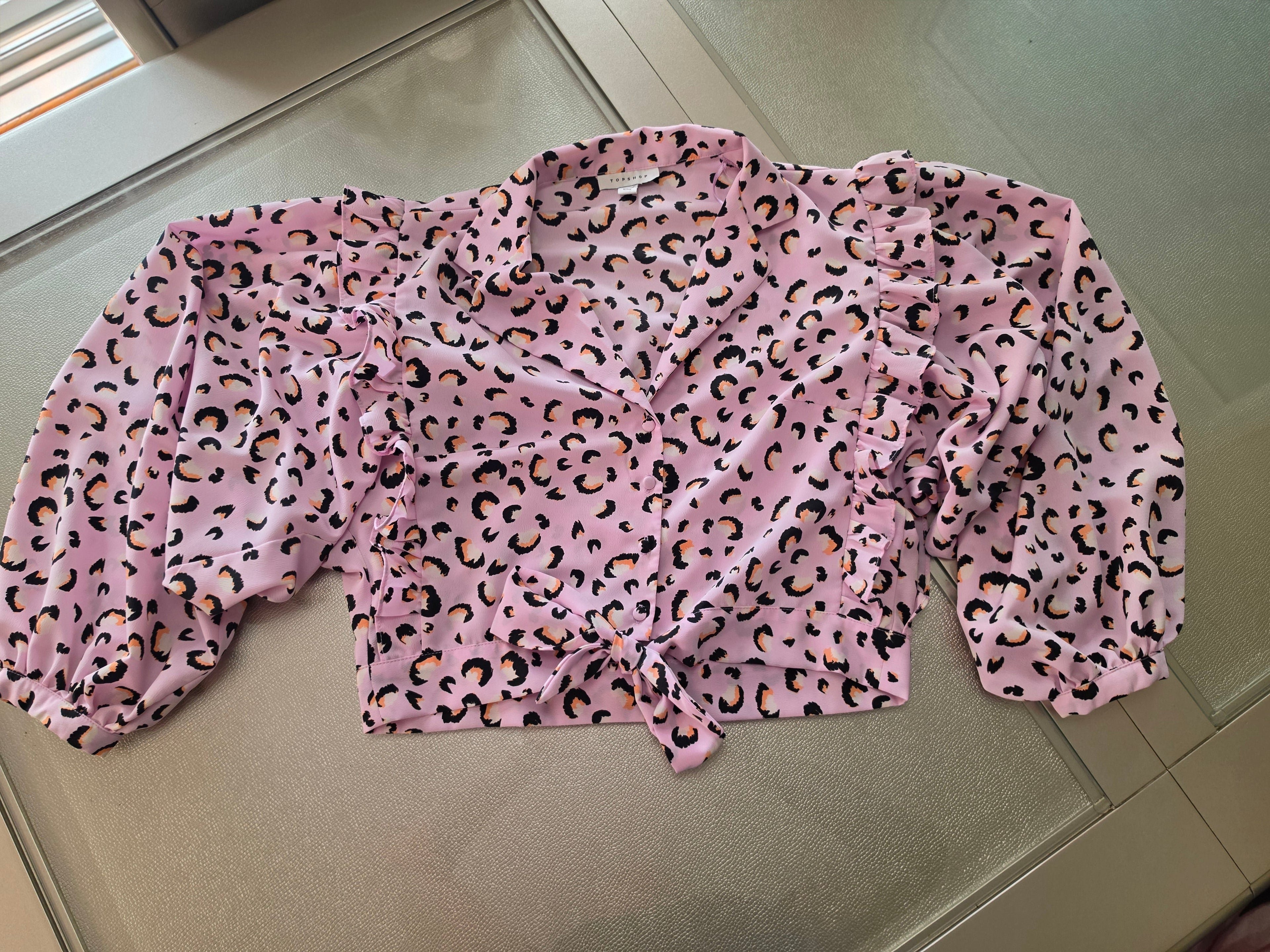 Pink leopard print blouse - neckline and ruffle detail