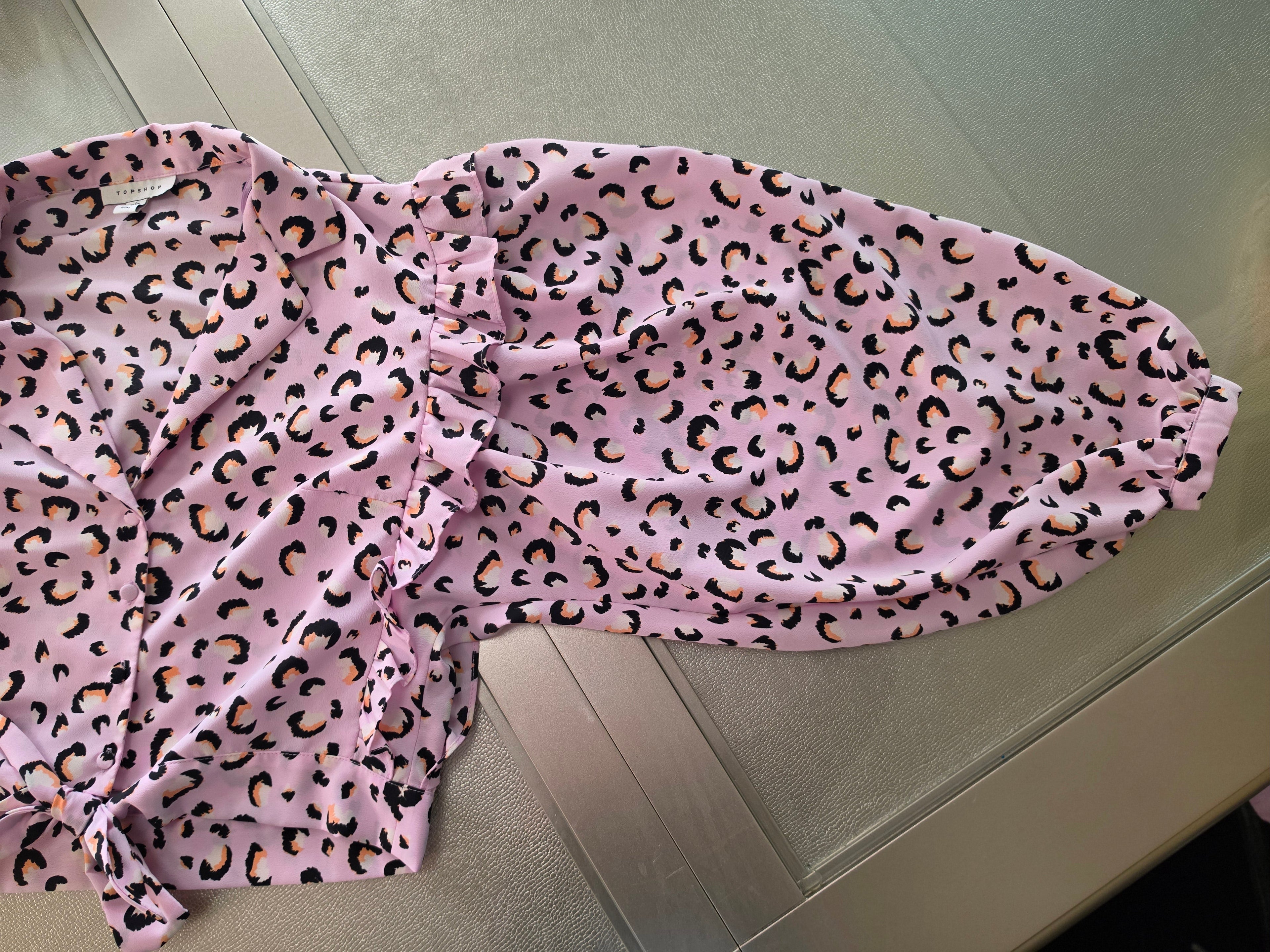 Pink leopard print blouse - flat lay overhead