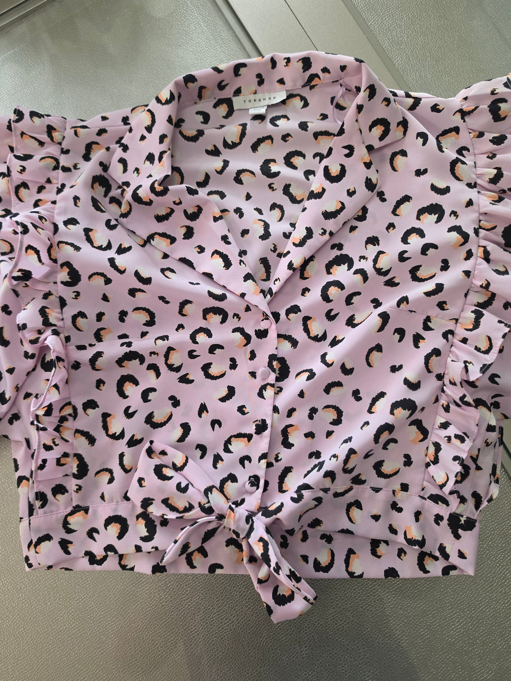 Pink leopard print blouse - button and tie hem detail close up