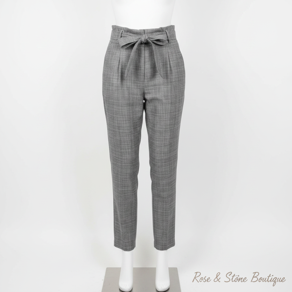 Grey glen plaid paperbag trousers with self-tie belt on white dress form mannequin, clean white background
