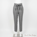 Grey glen plaid paperbag trousers with self-tie belt on white dress form mannequin, clean white background