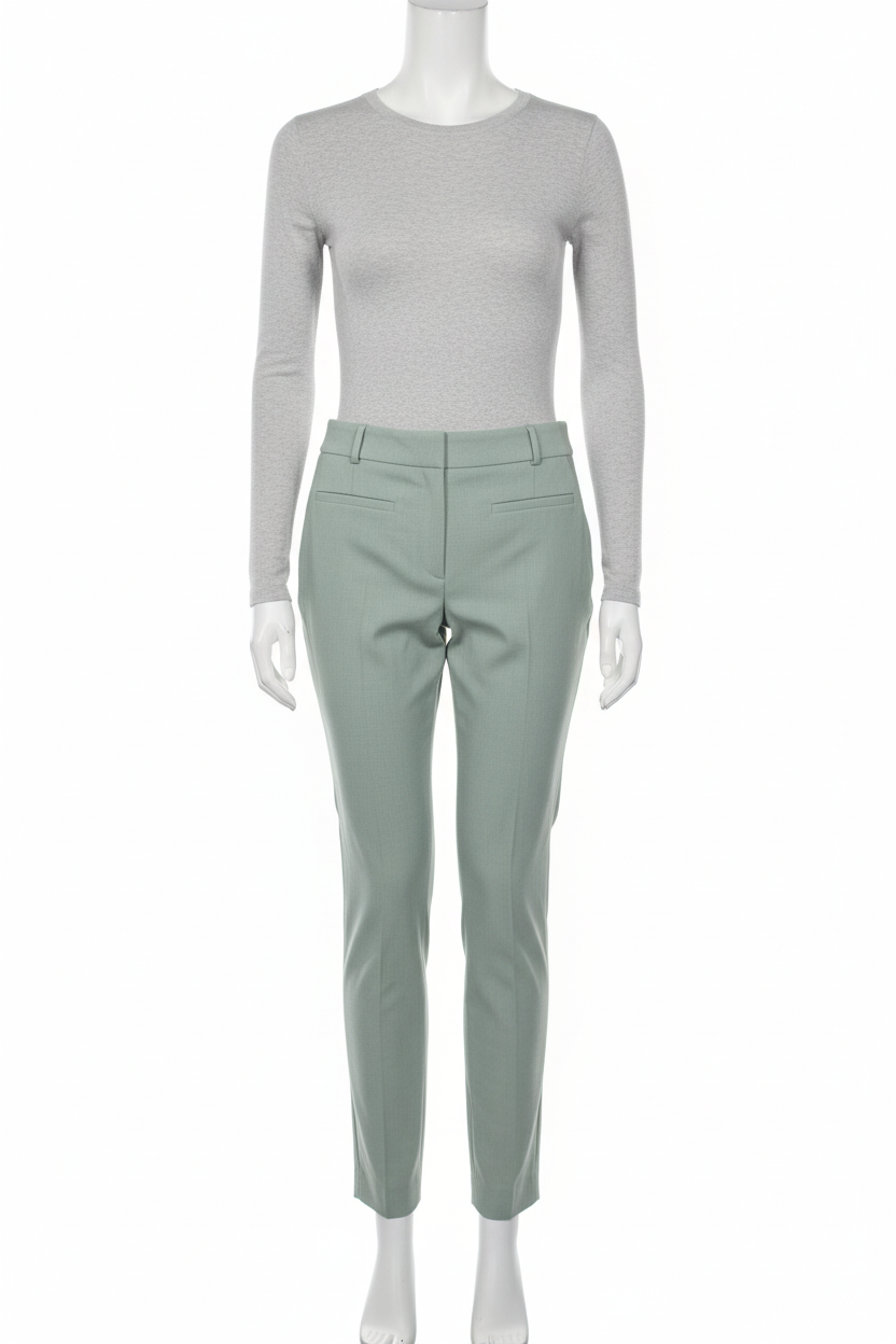 Sage mint slim leg ankle trousers on mannequin white background