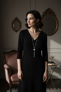 Model wearing moonstone lariat with black dress
