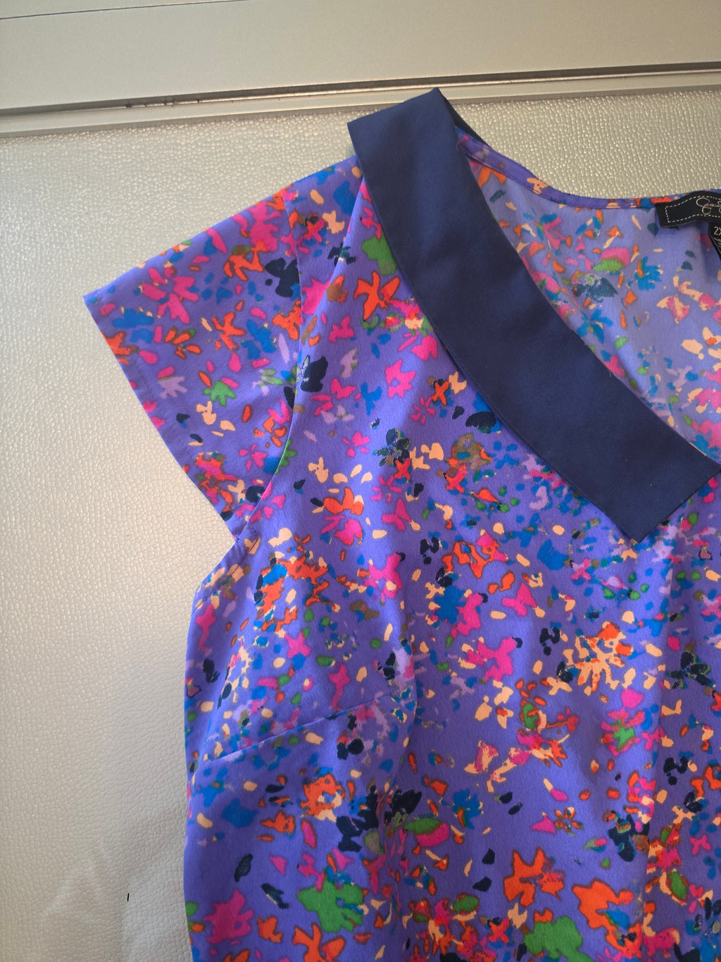 Jessica Simpson Peplum Blouse — Lavender Splatter Print | Junior Plus 2X